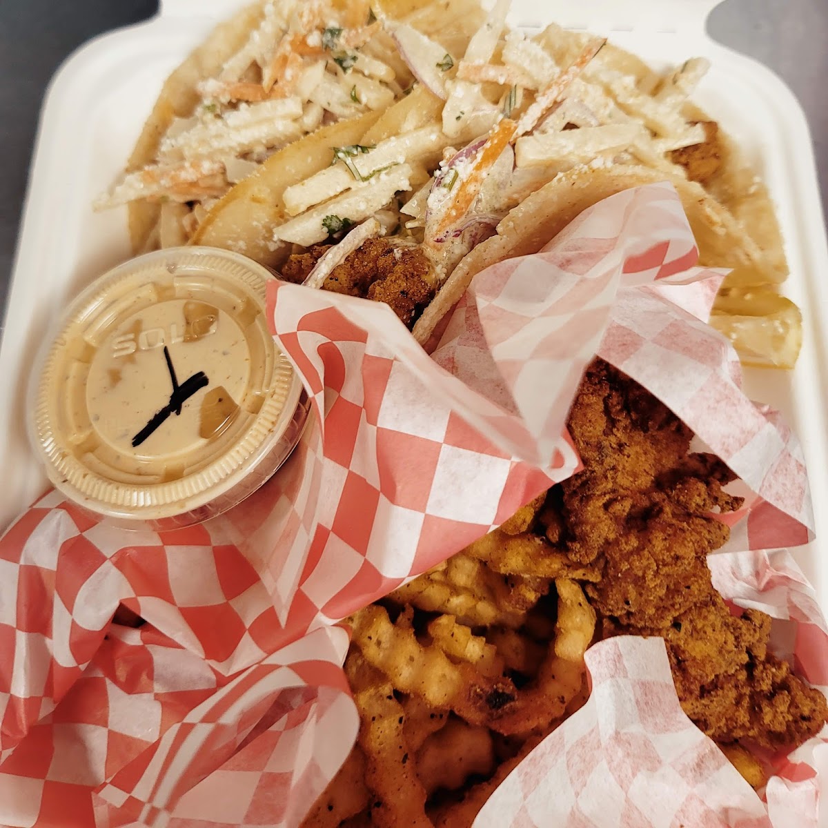 Taco and fried shrimp combo box with dipping sauce